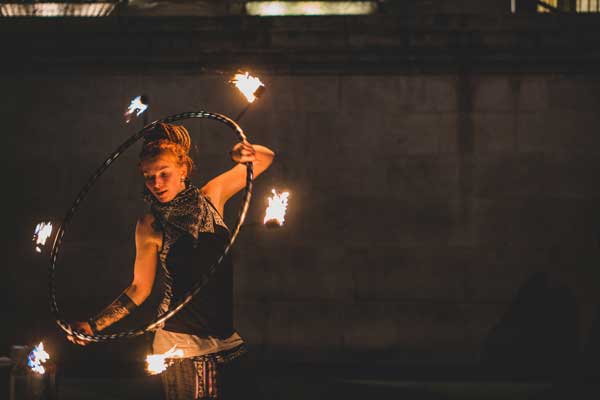 woman with a burning hoop at the circus