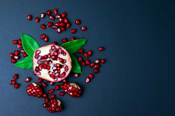 pomegranate on a blue table