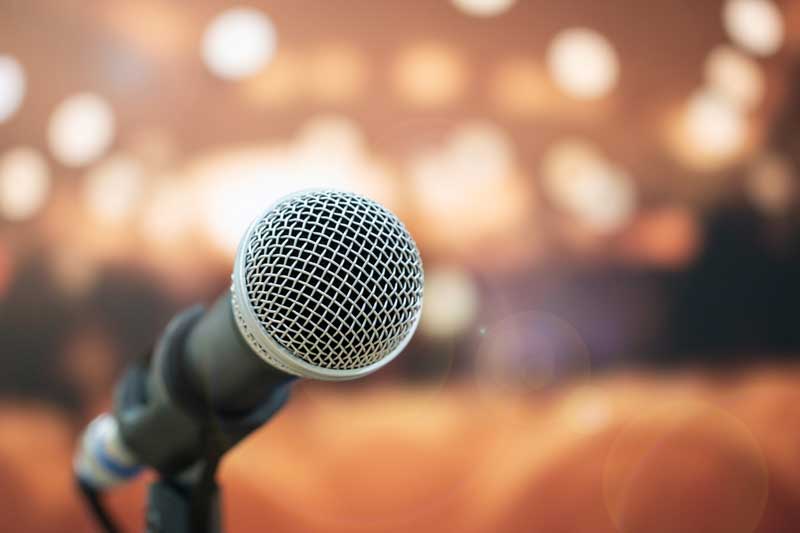 Close-up microphone on abstract blurred background